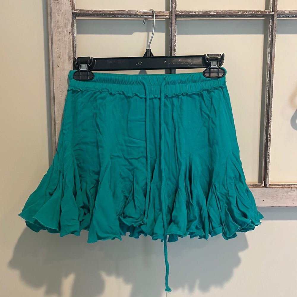 Little green ruffled skirt!! So cute for a casual day fit.